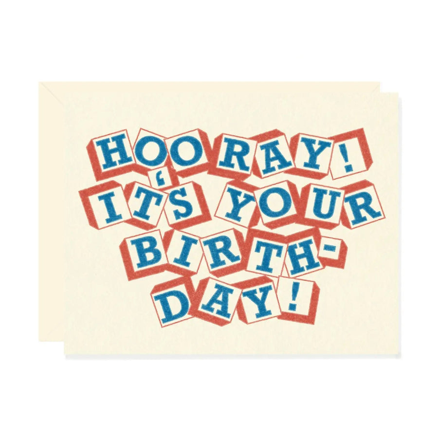 Birthday card with colorful text 'Hooray! It's your birthday!' on a beige background