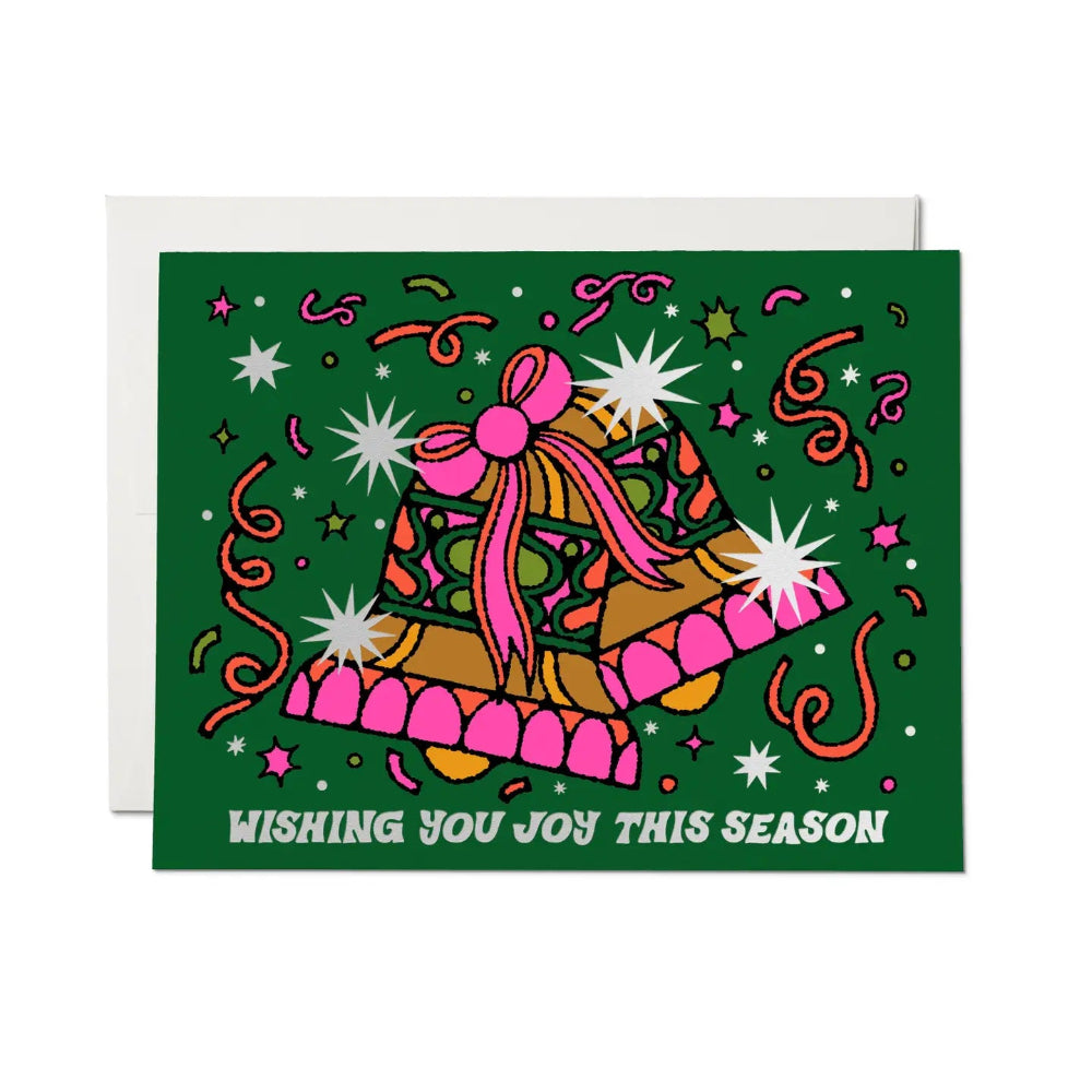 Green card with colorful bells and "Wishing you joy this season" on a white background