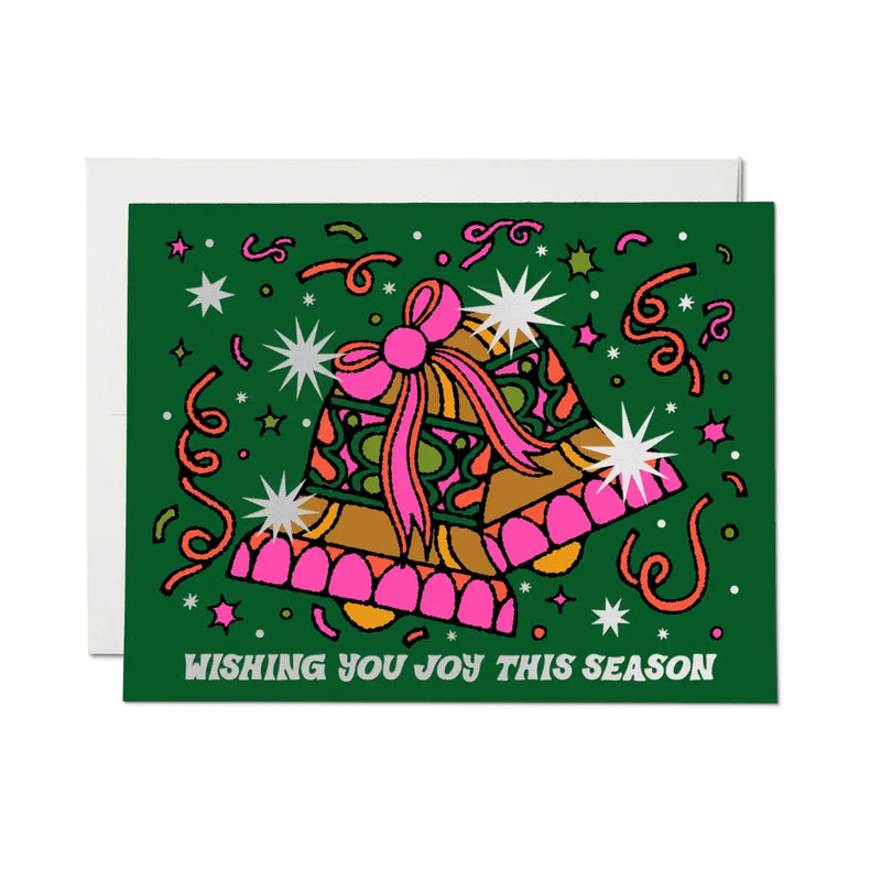 Green card with colorful bells and "Wishing you joy this season" on a white background