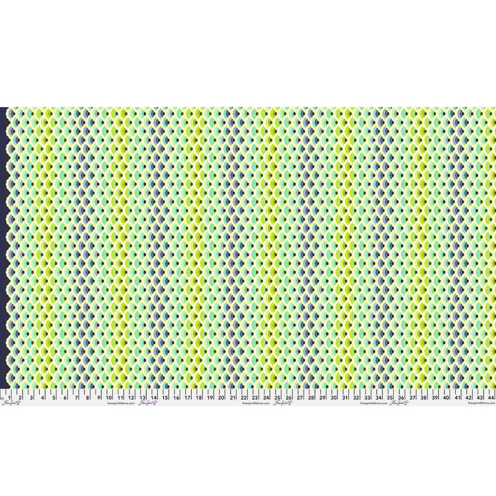 Lace multicolor patterned fabric with a ruler at the bottom for scale.