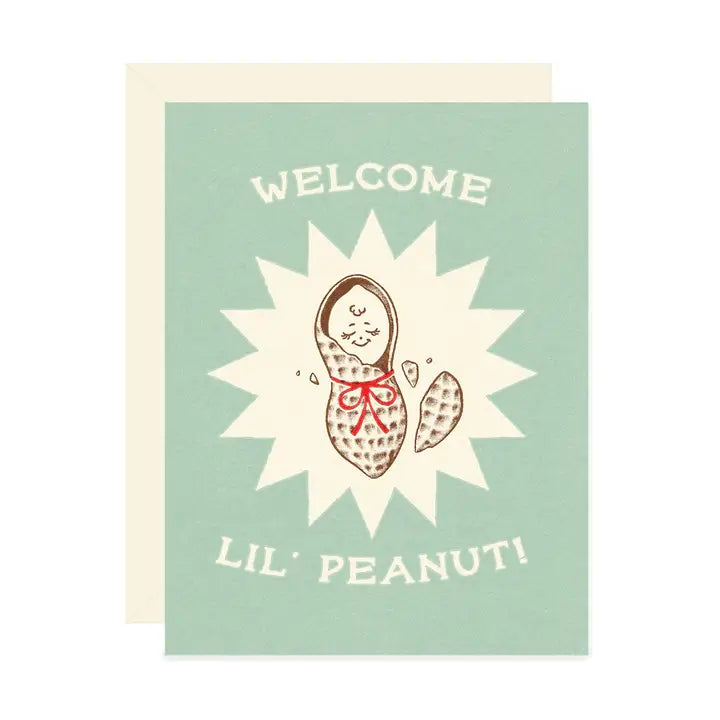 Light blue greeting card featuring a vintage inspired peanut baby illustration with text reading “Welcome Lil’ Peanut!” on a white background.