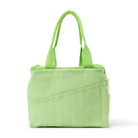 Green tote bag with multiple pockets on a white background