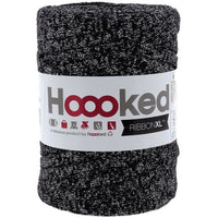 Spool of black and silver yarn with 'Hoooked' label on a white background