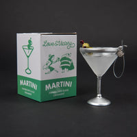 Martini glass ornament with packaging labeled 'Love & Victory' on a black background