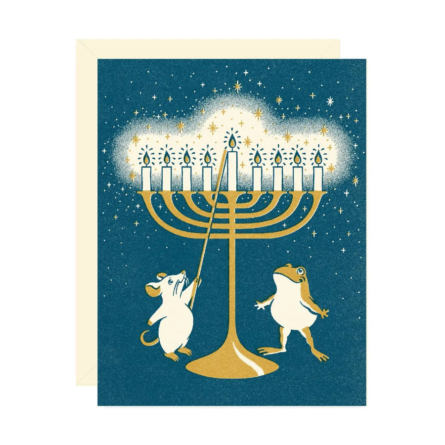 Card with illustration of a menorah and two animals on a blue background