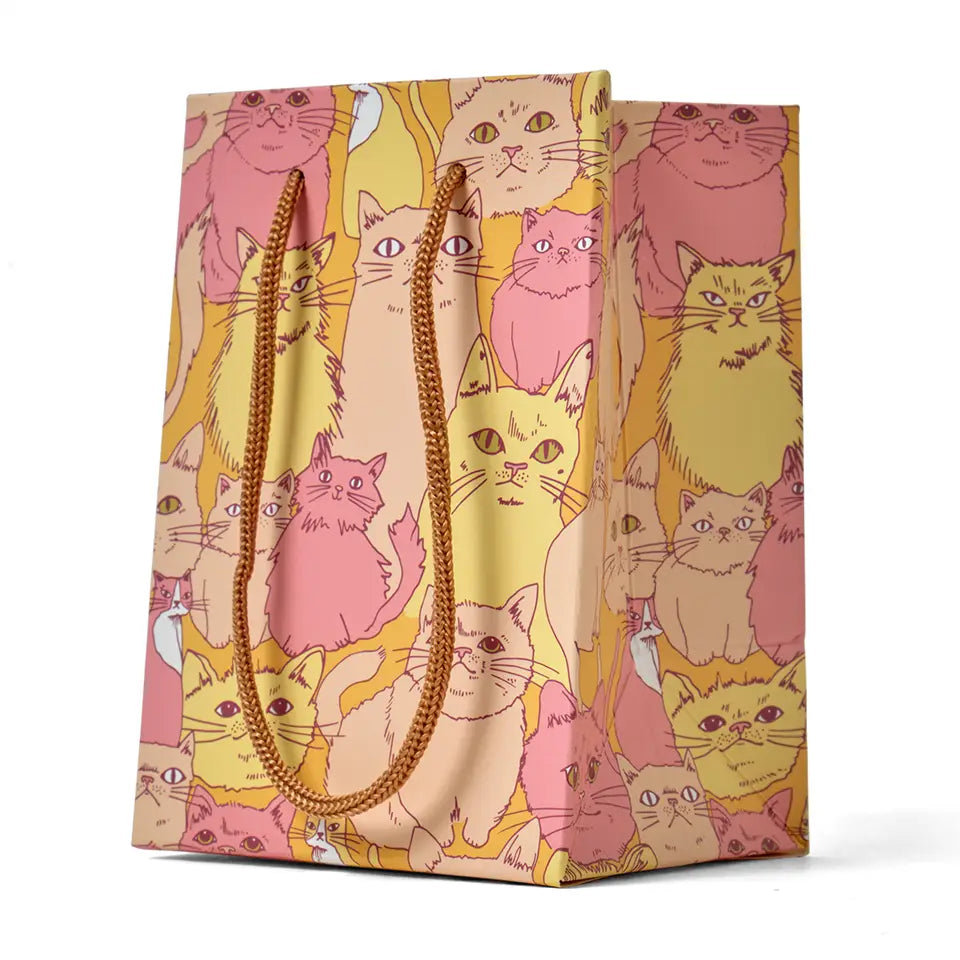 Gift bag with colorful cat pattern on a white background