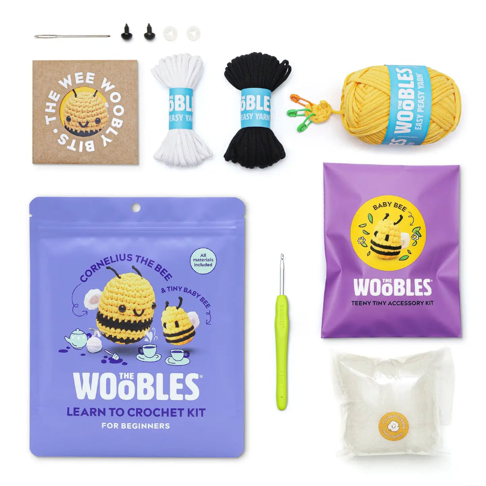 Woobles crochet kit with yarn, hooks, and packaging on a white background
