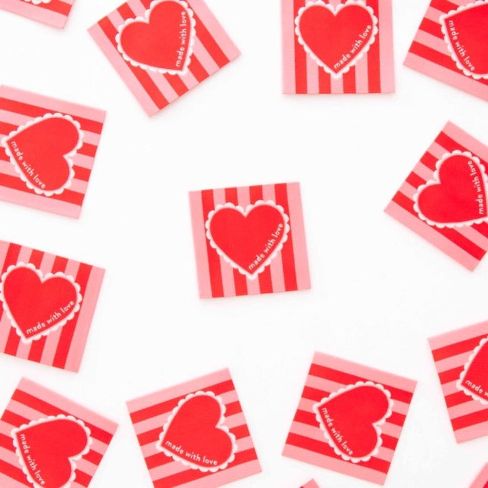 Red and white striped cards with heart designs and 'made with love' text on a white background
