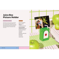 Juice box picture holder with green apples on a checkered tablecloth