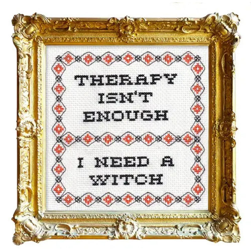 Decorative framed cross-stitch with text 'Therapy isn't enough, I need a witch' on a white background.