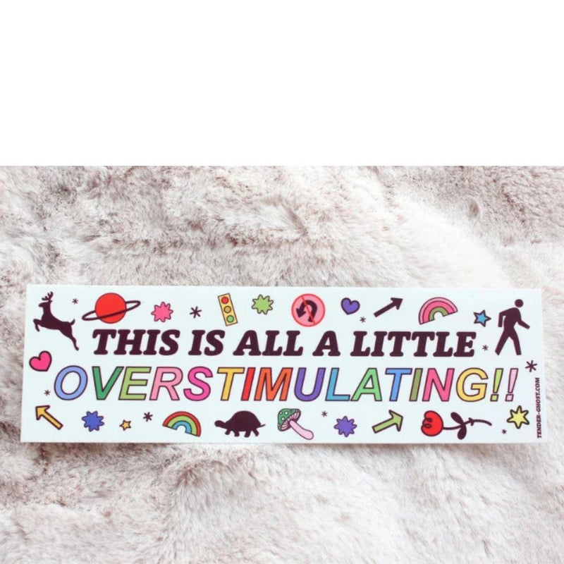 Sticker with colorful text and symbols on a textured surface