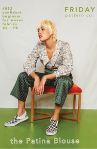 Model sitting on stool with red cushion, wearing black and white checker shoes, printed green pants, and a floral shirt with large collar. Set on a green and white background with Friday Pattern Co. branding and text.