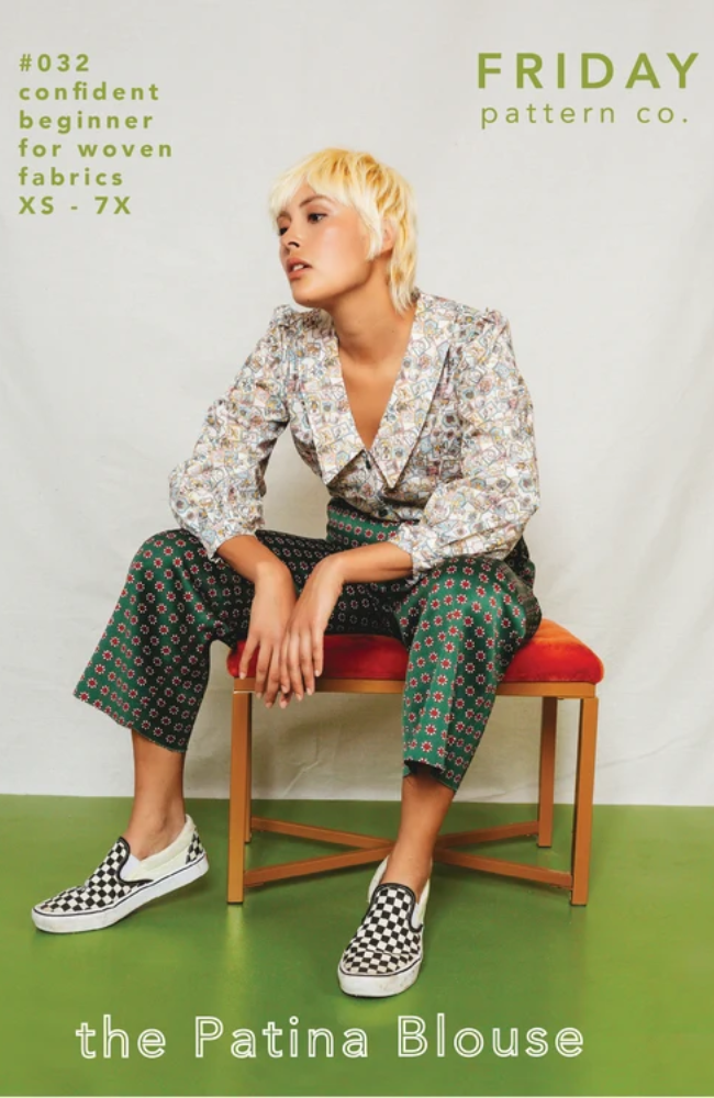 Model sitting on stool with red cushion, wearing black and white checker shoes, printed green pants, and a floral shirt with large collar. Set on a green and white background with Friday Pattern Co. branding and text.