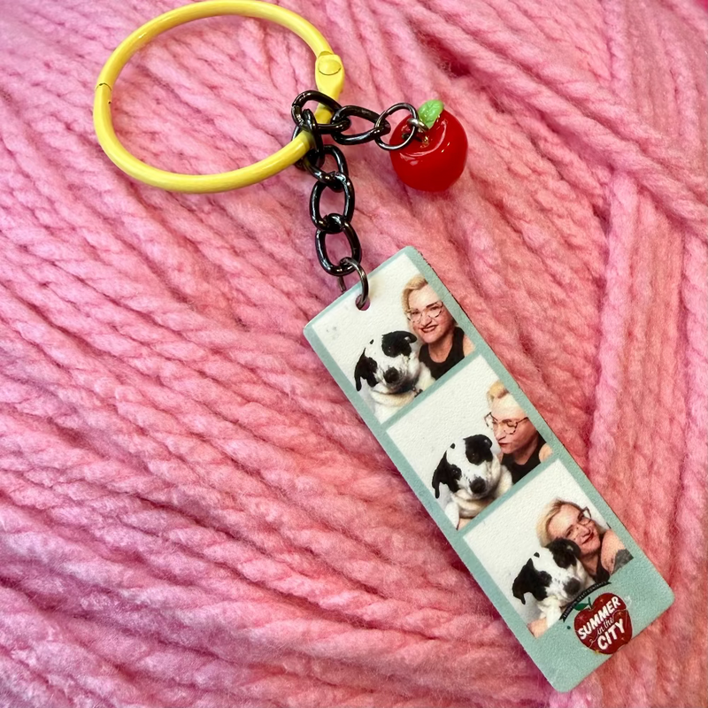 Keychain with photo strip and apple on pink yarn