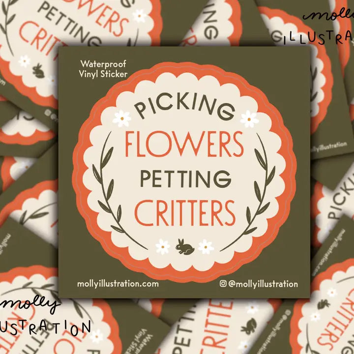 Vinyl sticker with text 'Picking Flowers Petting Critters' on a green background, surrounded by more stickers.
