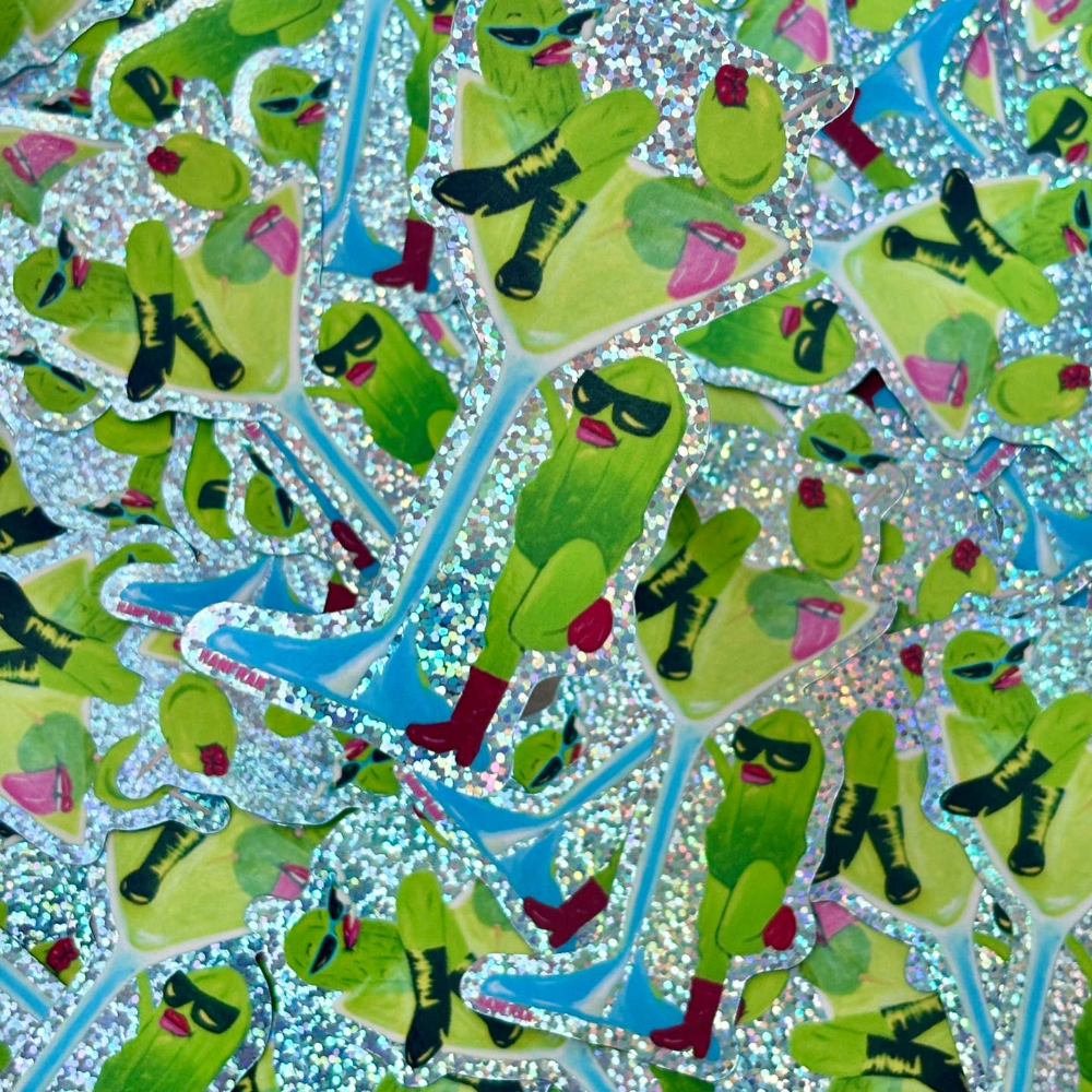 A close-up of repeated die-cut stickers featuring two stylized pickles with boots and pink lips on a glittery silver background. 