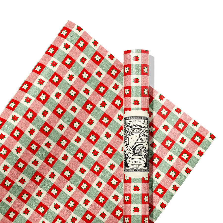 Red and green checkered rolls of wrapping paper with poinsettias on it