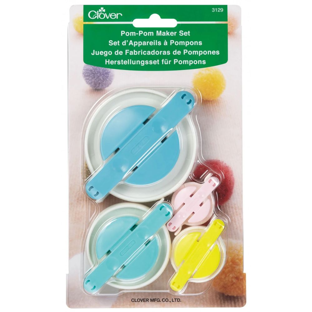 Clover pom-pom maker set packaging with pom-poms on a white background