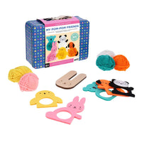 Pom-pom making kit with animal-shaped tools and yarn balls on a white background