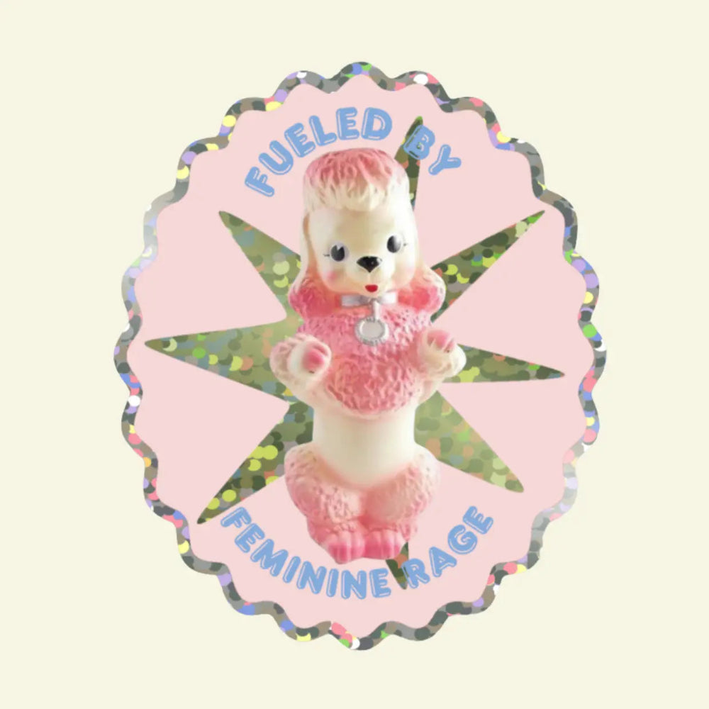 Pink poodle sticker with glittery edge with the words "Fueled by feminine rage"