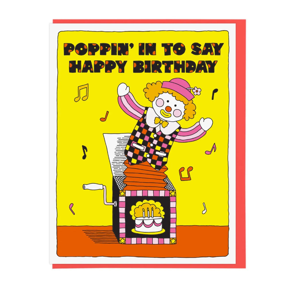 Birthday card with clown popping out of a box, with text 'Poppin' in to say Happy Birthday', on a yellow background.