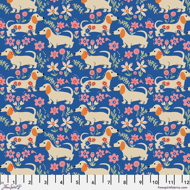 A repeating fabric pattern featuring cream dachshunds, pink and white flowers, and green leaves on a deep blue background.
