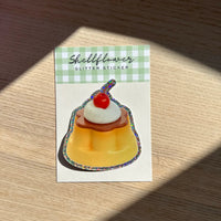Custard sticker with glittery edge on a wooden background