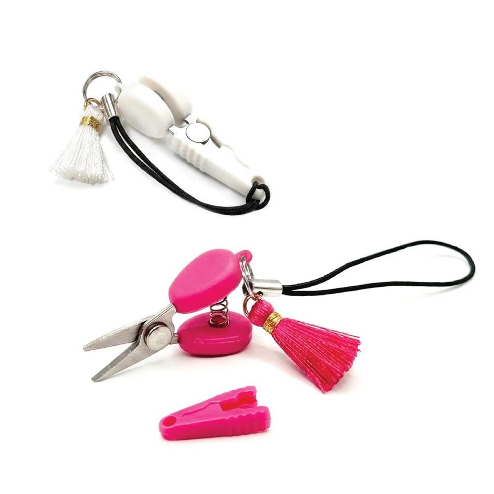 Two mini scissor with covers and matching tassels. One pink, one white.
