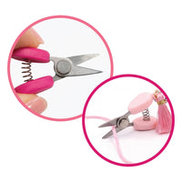 Two mini scissor with covers and matching tassels. One light pink, one magenta.