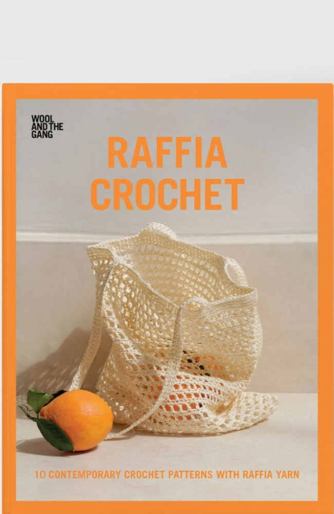 Book cover for 'Raffia Crochet' by Wool and the Gang, featuring a cream crocheted mesh bag with an orange on a light beige background, framed by a bold orange border.
