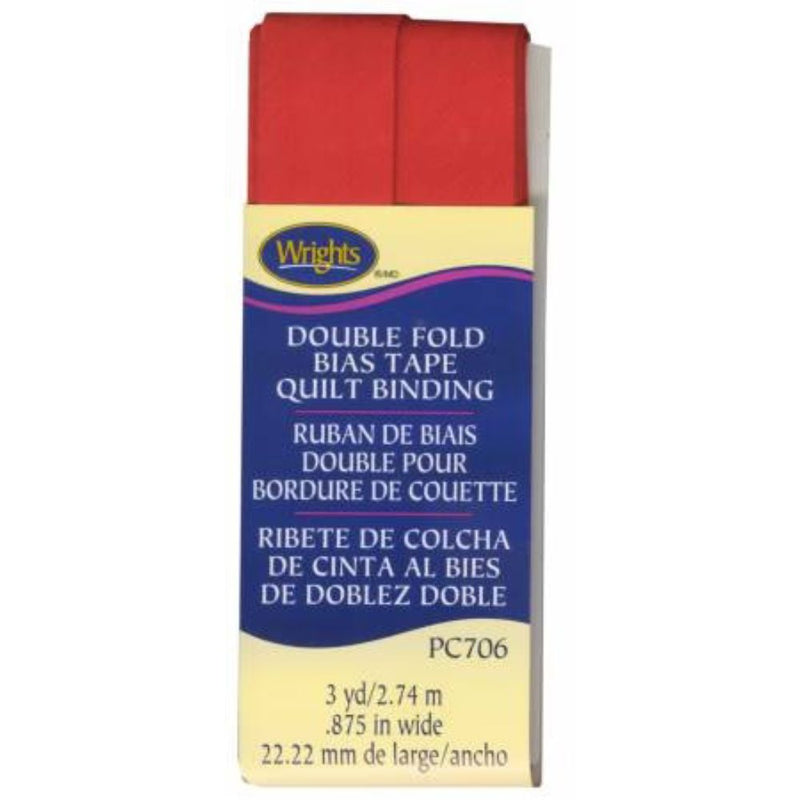 Box of Wrights double fold bias tape quilt binding with red fabric strip.