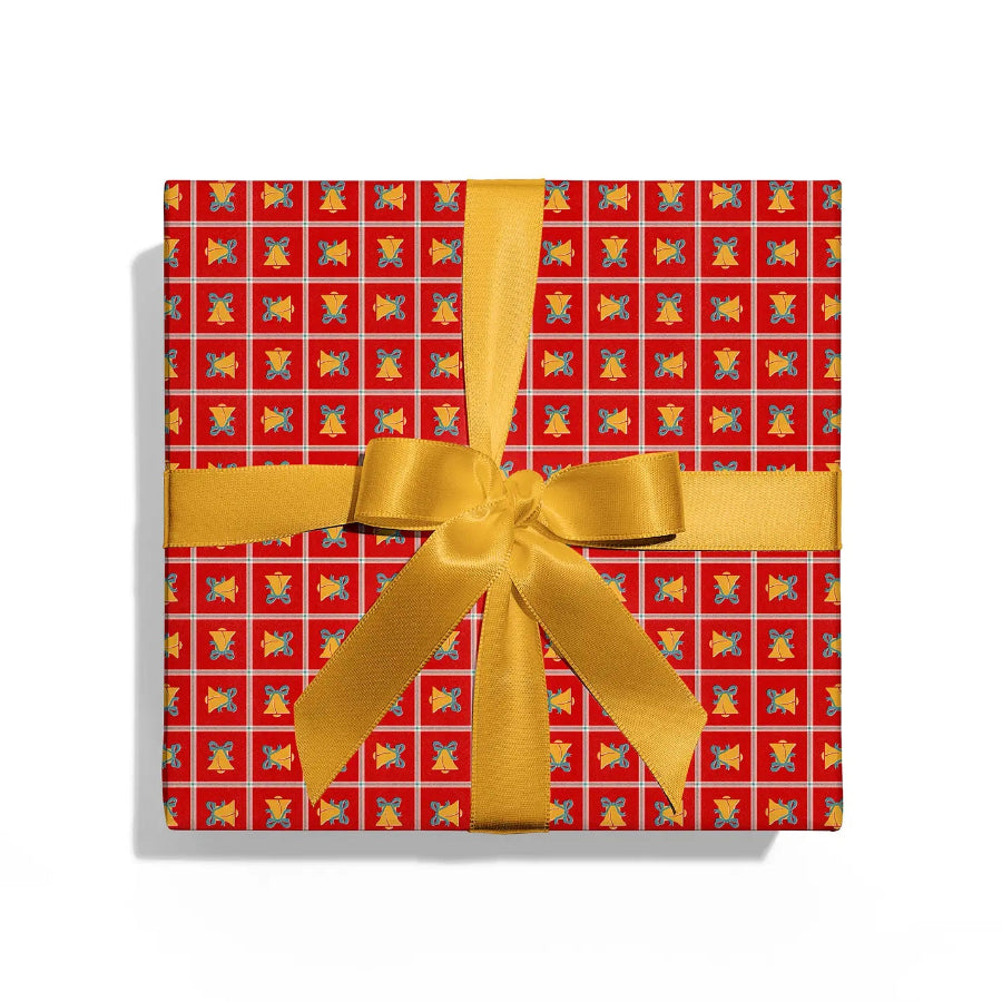 Gift box with red patterned paper and gold ribbon on a white background