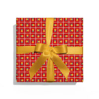 Gift box with red patterned paper and gold ribbon on a white background