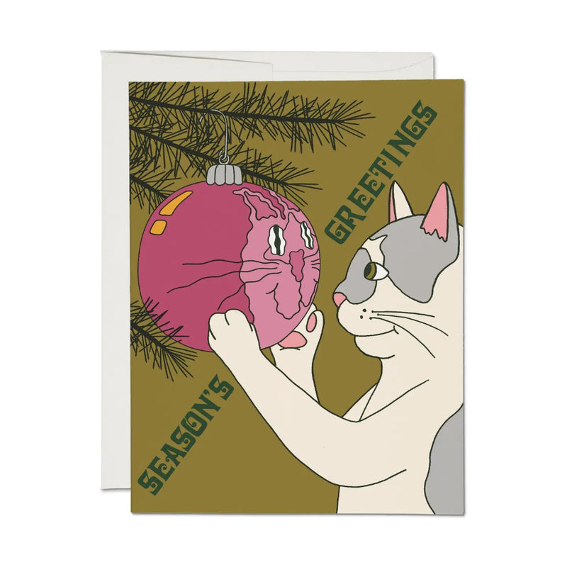 Greeting card with a cat and Christmas ornament illustration on a green background