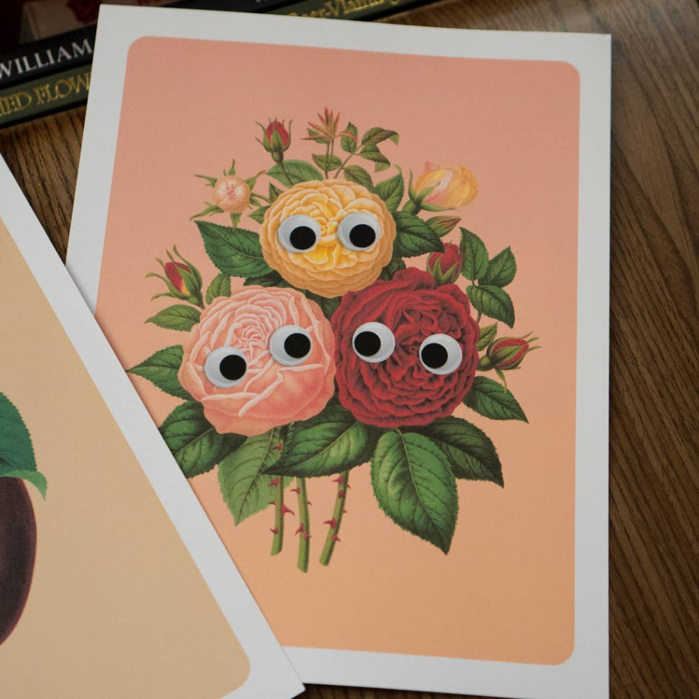 Print of roses with googly eyes on peach background