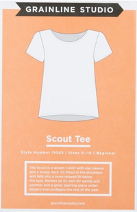 Line drawing of a t-shirt on a light orange background with Grainline Studio branding and text.
