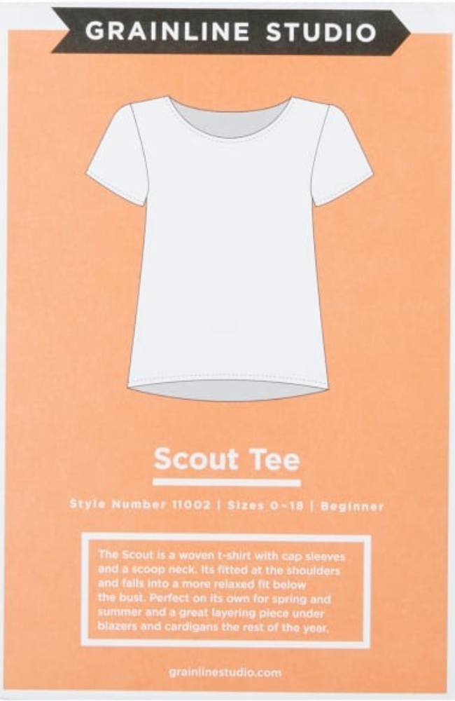 Line drawing of a t-shirt on a light orange background with Grainline Studio branding and text.