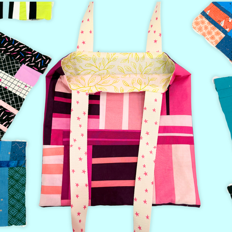 Colorful fabric pieces with patterns on a light blue background