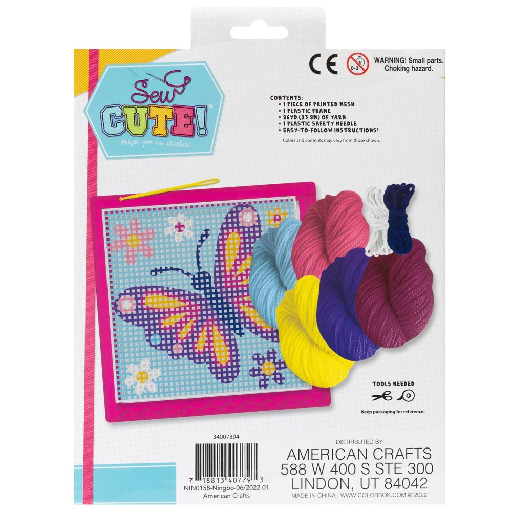 Craft kit packaging with yarn and a cross-stitch pattern of a butterfly on a white background