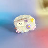 Cute cartoon sheep hair claw with a colorful background
