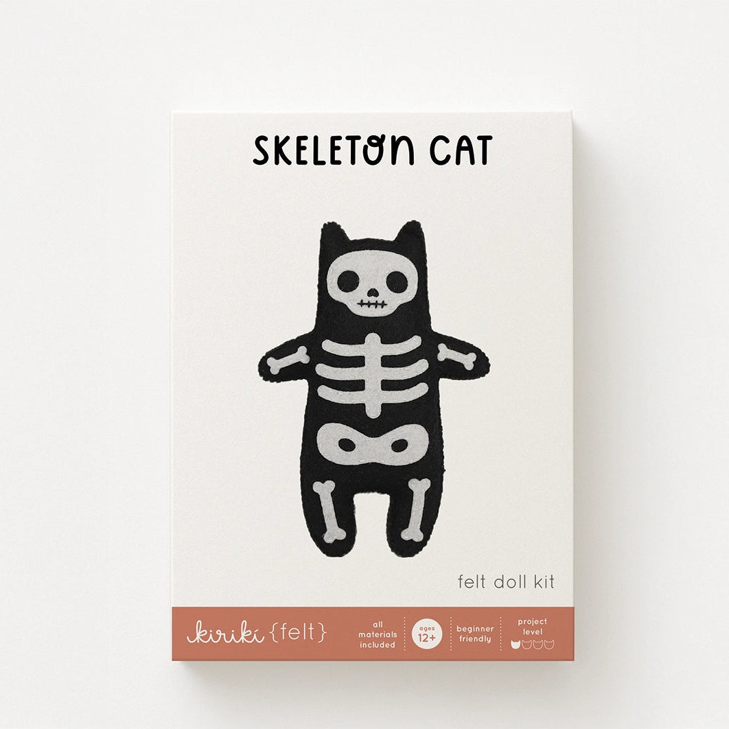 Skeleton cat felt doll kit packaging on a white background