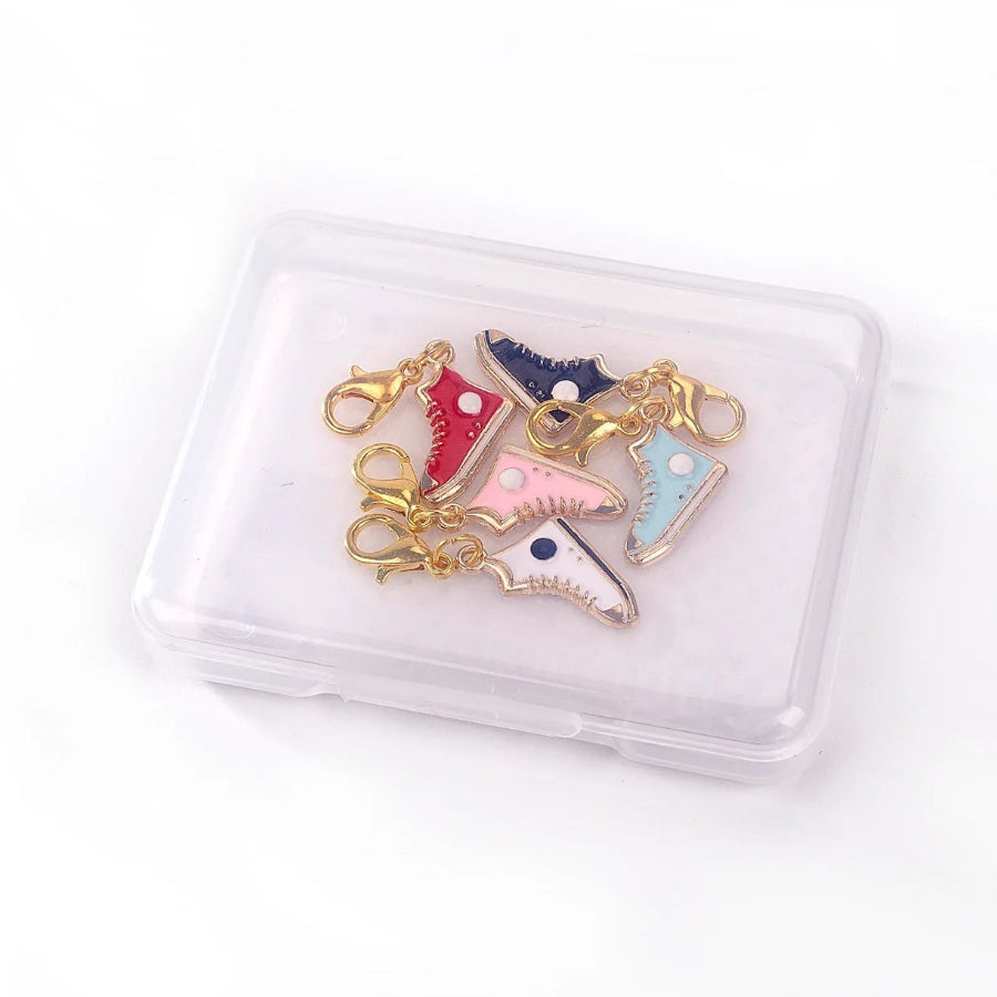 Sneaker-shaped enamel and metal stitch markers in small plastic carrying case