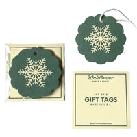 Set of green gift tags with snowflake design, one tag displayed outside packaging on a white background.