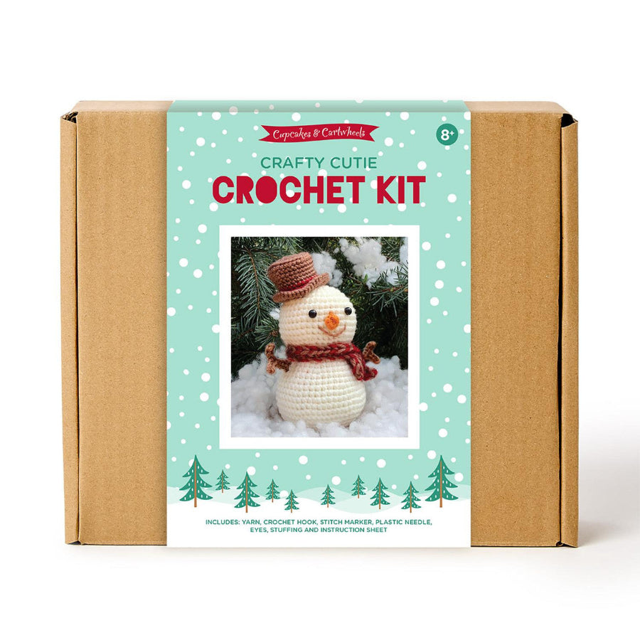Crochet kit packaging with a snowman illustration on a white background