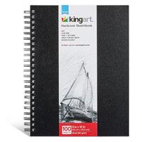 Spiral bound black hardcover sketchbook with branded packaging against a white background