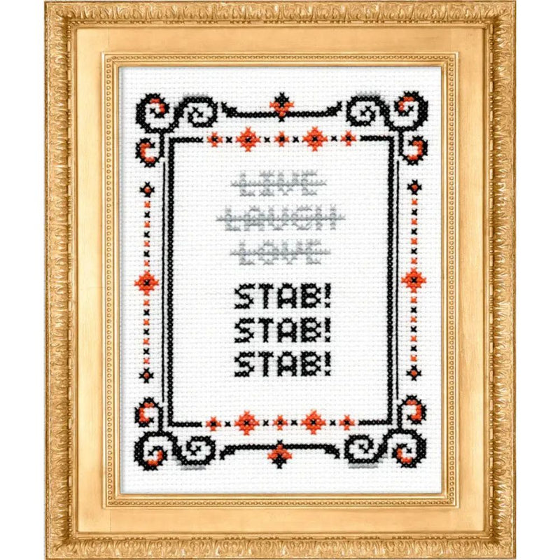 Cross-stitched design with text 'Live Laugh Love STAB! STAB! STAB!' in a decorative frame.