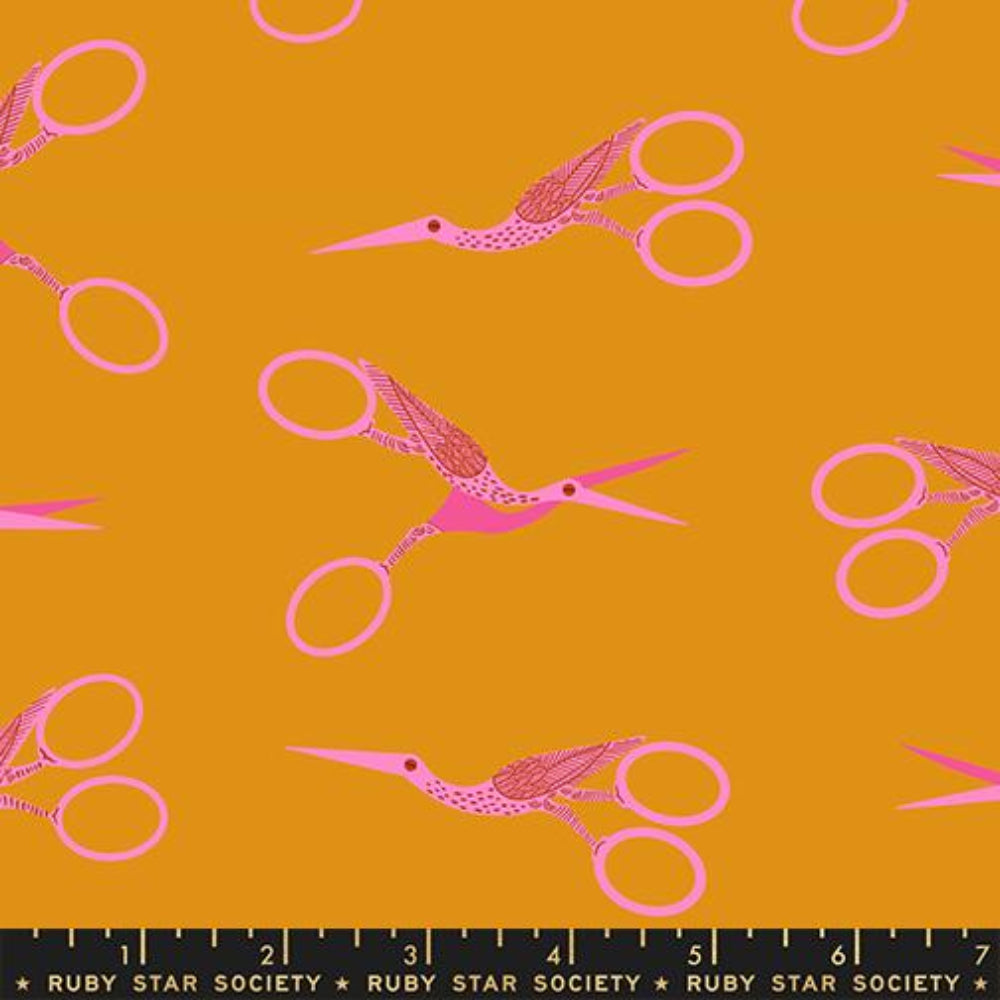 A repeating pattern of pink stork scissors  a mustard yellow background, with a black ruler strip at the bottom labeled Ruby Star Society.