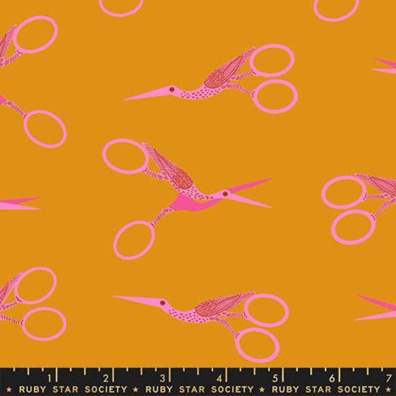 A repeating pattern of pink stork scissors  a mustard yellow background, with a black ruler strip at the bottom labeled Ruby Star Society.