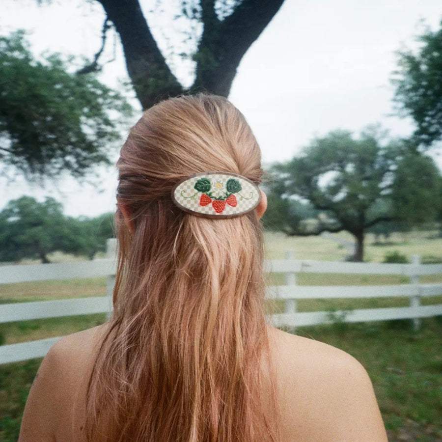 Lady wearing the strawberry fields barrette