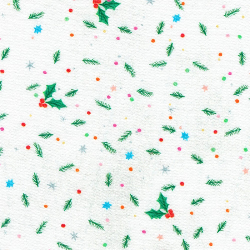 Close-up of white fabric with pine boughs, holly berries and leaves, and various dots and speckles.